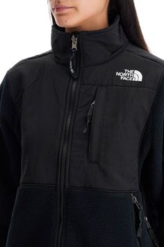 The North Face short sports jacket made of recycled fleece with inserts in recycled nylon canvas. High-neck model equipped with a closure and three zip pockets, adjustable hem with elastic drawstrings and underarm openings with zippers. Iconic TNF logo embroidered on the chest and back. Comfortable fit. The model is 177 cm tall and wears size XS. Composition: 100%R-PL, 100%R-PA North Face Jacket Women's, North Face Shorts, Fit Ideas, Italian Fashion Designers, Casual Blazer, North Face Women, Sports Jacket, North Face Jacket, Black Jacket