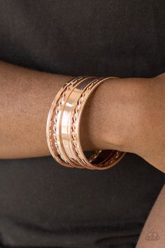 Featuring smooth and twisted surfaces, mismatched rose gold bangles stack across the wrist for a casual look.

 Sold as one set of seven bracelets. Rose Gold Bangles, Rose Gold Bangle Bracelet, Gold Bracelet Set, Nickel Free Jewelry, Rose Gold Bangle, Box Accessories, Stacked Bangles, Paparazzi Accessories, Gold Bangle Bracelet