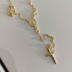 This beautiful rosary necklace is gold plated plated. It doesn't tarnish or change color. Size of this rosary necklace is 46 cm - adjustable chain.  Beads : 2,5 mm Weight:  6,8 gr  This is ideal gift for catholic women or teenage. Rosary has a beautiful Miraculous Medal (or Our Lady of Medjugorje Medal) and Cross. You can choose the medal of Our Lady of Medjugorje or the miraculous medal. Want to see more similar necklaces? You are in the right place, :) follow the link.. https://www.etsy.com/yo Dainty Crucifix Necklace With Adjustable Chain, Gold Rosary As A Gift, Elegant Adjustable Gold Rosary, Adjustable Gold Cross Rosary, Adjustable Gold Rosary With Cross, Adjustable Gold Cross Lariat Necklace, Elegant Adjustable Gold Cross Necklace, Adjustable Gold Crucifix Necklace, Adjustable Crucifix Necklace With Adjustable Chain