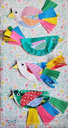 three colorful birds made out of construction paper