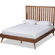 a bed with white pillows and wooden headboard on it's sides, against a white background