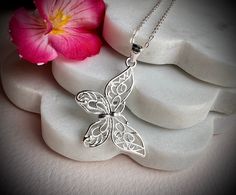 This a lovely necklace in 925 sterling silver with a cute Butterly as pendant hand crafted by us. Ideal as gift or for your fashion.  The chain is about 16" with an extended 2 more inches in case you need 18" as size.  The pendant is about 30x38 mm.  925 hallmark tag. It comes in a gift package. We aim to dispatch our orders in 24 hours using free 48 hours delivery but if you need your item quicker there is an option on the checkout for next day delivery for only £ 3.50. Delicate Sterling Silver Butterfly Necklace In White Gold, Delicate Silver Charm Necklaces For Gift, White Gold Butterfly Necklace For Gift, Delicate Sterling Silver Butterfly Jewelry, Delicate Silver Charm Necklace For Mom, Silver Dainty Jewelry With Butterfly Charm, Silver Butterfly Jewelry Gift, Silver Butterfly Jewelry As Gift, Nickel Free Butterfly Necklace For Gifts