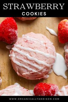 strawberry cookies with icing and strawberries on top