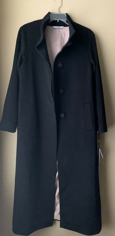 Fleurette Black Stand Collar Cashmere Long Coat  Color; Black Size: 10 (armpit to armpit 21", shoulder 18", sleeve 23 3/4", length 48", vent 15 1/2") Stand collar, long coat. Button closure. 100% cashmere Lining: 100% acetate Track Page Views With Auctiva's FREE Counter Black Wool Coat With Button Cuffs For Business, Formal Black Wool Coat With Button Cuffs, Black Wool Coat With Button Cuffs For Formal Occasions, Black Long Pea Coat With Concealed Placket, Black Wool Coat With Button Cuffs For Work, Black Long Outerwear With Button Closure, Black Wool Coat With Button Closure For Formal Occasions, Formal Black Wool Coat With Button Closure, Black Formal Wool Coat With Button Closure