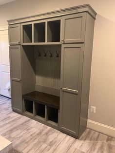 an empty room with some cabinets and benches