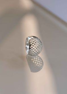 Like wearing modern art on your hand! Our Lattice Dome Ring draws inspiration from simple yet complex patterns in Geometry. Expertly handmade and hand finished with 925 sterling silver making it an investment piece you will treasure for a lifetime. Handmade jewelry is always thicker in gauge and higher in quality. D E T A I L S > Materials - .925 sterling silver > Dimensions: 16mm or .6 inches wide, Dome height 5.20mm or .2 inches > Weight - .20oz approximately >> If your size is Adjustable Sterling Silver Dome Ring In Modern Style, Elegant Adjustable Silver Dome Ring, Modern Adjustable Sterling Silver Dome Ring, Adjustable Modern Sterling Silver Dome Ring, Adjustable Minimalist Sterling Silver Dome Ring, Chunky Silver Rings, Gift Wrapper, Artisan Rings, Dome Ring