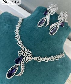 Hey, Welcome to our shop! Sabyasachi Inspired Trendy Latest Royal Silver Plated American Diamond Purple heavy look Bridal Ad Long Heavy CZ necklace set with Dangler earrings ,punjabi wedding,pakistani nikaah jewellery, bridal set Indian Wedding Bollywood Bridal Style Fine Quality / Engagement Jewelry / Statement Jewelry Set/ Dangler Earring For Women And Girl/ Best For Anniversary / Birthday / Valentine's Day.  < 1 DAY ITEM SHIPMENT | 7-8 Days Delivery TIME> About our Jewellery - Classic, Brilli Elegant Bridal Sets With Crystal Stone Work, Luxury Purple Jewelry For Wedding, Elegant Bridal Sets With Intricate Design For Party, Elegant Bridal Sets With Stone Work, Elegant Stone Work Jewelry Sets For Formal Occasions, Elegant Formal Jewelry Sets With Stone Work, Purple Diamond Necklaces For Wedding, Purple Diamond Necklace For Wedding, Purple Diamond Wedding Necklace