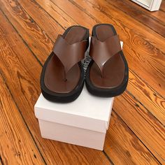 Princess Polly Platform Sandals In Brown. New Out Of The Box. Brown Synthetic Toe Post Flip Flops, Brown Synthetic Round Toe Flip Flops, Brown Flat Flip Flops, Brown Flat Platform Sandals, Brown Synthetic Flat Flip Flops, Brown Leather Flat Heel Flip Flops, Brown Toe Post Sandals With Cushioned Footbed, Brown Synthetic Flat Heel Flip Flops, Brown Synthetic Flip Flops