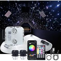 an image of some lights and remotes in the dark room with stars on the ceiling