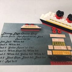 there is a lego boat and some other items on the table with it's instructions