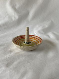 a small bowl with a bottle in it