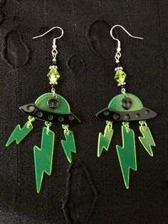 These lightweight a acrylic alien earrings are perfect for anyone who loves rave wear as they'd look great in black light race rooms  Perfect for any alien lover  Sterling silver hook Scenecore Earrings, Space Themed Accessories, Aliencore Outfit, Alien Aesthetic Outfit, Alien Accessories, Alien Clothing, Alien Outfit, Alien Decor, Alien Jewelry