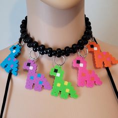 These kandi necklaces are made with pony beads and dinosaur charms. One size fits all. This Item adjust up to 17 Inches.  This Item is made to order. Perfect for any event! You will get lots of compliments in this unique wearable art! Stand out at your next event! Edm festival  Raves Party  Rave outfit  Festival outfit Pride Adjustable Multicolor Rave Choker, Adjustable Rave Style Choker, Rave Multicolor Choker For Festivals, Rave Style Multicolor Choker, Kandi Clothes, Kandi Necklaces, Kandi Choker, Rave Necklace, Dino Necklace