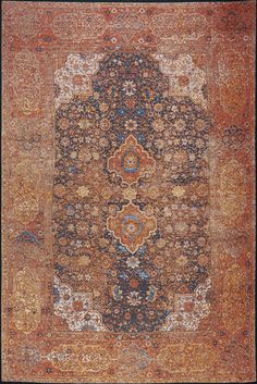 an antique rug with many different colors and patterns on it, including blue, red, orange