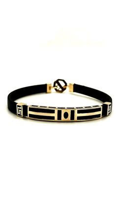 This stylish gold men's bracelet is the perfect accessory to complement your style on special occasions or for daily use by combining elegance and masculinity. Handmade and carefully designed, this bracelet is produced using durable materials and is long-lasting. PRODUCT DETAILS *14K or 585 Gold. *All of our products has the stamp ''585'' on them (which states that this is real gold) *The black leather bracelet is a quality material. *All products are sent with a gift box. *Thickness of leather : 6 mm *The Gold parts weight is 5.02 gr. Modern Yellow Gold Leather Bracelet, Designer 14k Gold Bracelet With Polished Finish, Luxury Gold Bangle Leather Bracelet, Modern Formal Bracelets With Black Band, Classic Black Engraved Bracelets, Elegant Gold Bracelet With Black Band, Elegant Engraved Leather Bracelet For Formal Occasions, Luxury Engraved Black Leather Bracelet, Designer Gold Leather Bracelet Adjustable