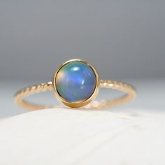 Opal ring solid gold ring with ethiopian opal stacking opal | Etsy Yellow Gold Ring With Ethiopian Opal And Birthstone, Yellow Gold Ethiopian Opal Ring With Birthstone, Yellow Gold Ethiopian Opal Birthstone Ring, Dainty 14k Gold Solitaire Opal Ring, Gold Opal Stackable Ring, Gold Stackable Opal Ring, 14k Gold Opal Ring With Bezel Setting, 14k Gold Opal Cabochon Promise Ring, Opal Ring With Bezel Setting