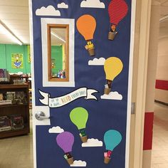 a door decorated with hot air balloons