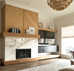 a living room filled with furniture and a fire place in the middle of a room