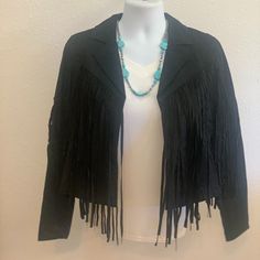 Wow!!!!!!! This Faux Suede Jacket Is So Cute, Classy And Chic! Suede Bodice With Long Sleeves Features Open Front Closure With Fringe Detail. This Jacket Is So Versatile And Can Be Dressed Up With A Skirt And Booties For A Night Out Of Dancing Or Dressed Down With Jeans And Boots And Sitting By The Fire With Friends. Black Fringe Long Sleeve Outerwear, Black Fringe Outerwear For Fall, Chic Black Outerwear With Fringe, Black Fringe Outerwear, Black Fringed Outerwear For Winter, Chic Leather Jacket With Fringe And Long Sleeves, Black Fringe Outerwear For Winter, Chic Long Sleeve Leather Jacket With Fringe, Chic Long-sleeve Leather Jacket With Fringe