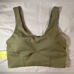 This Is A Light Support Sports Bra Made With Smooth Fabric To Help You Feel Supported. It’s Moisture Wicking And A Longline Length. Has Removable Pad, Comfort Straps, And Flat Seams For Comfort. Size Small Will Fit: 32c, 34a, 34b, 36a Body: 75% Recycled Polyester And 25% Spandex. Lining: 86% Recycled Polyester, 8% Spandex, And 6% Polyester. Machine Wash Cold Gentle Cycle, Tumble Dry Low. Green Scoop Neck Sports Bra With Built-in Bra, Green Stretch Scoop Neck Sports Bra, Green Compressive Sports Bra For Light Sports, Green Compressive Activewear With Medium Bust Support, Green Activewear With Medium Bust Support For Yoga, Green Scoop Neck Stretch Sports Bra, Green Athleisure Sports Bra With Medium Bust Support, Nylon Gym Tops Bra Friendly, Green Fitted Sports Bra With Scoop Neck