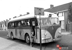 an old black and white photo of a bus