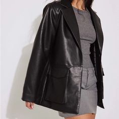 This Jacket Is Oversized And Features A Material In Pu And A Classic Collar. It Has Slightly Padded Shoulders, A Snap Button Closure And A Flap Pocket With A Snap Button. Size Listed As 36 (Women’s Small) Trendy Workwear Outerwear With Multiple Pockets, Chic Leather Jacket With Pockets And Long Sleeves, Winter Workwear Leather Jacket With Pockets, Chic Solid Leather Jacket With Pockets, Chic Winter Streetwear Blazer, Fall Workwear Blazer With Multiple Pockets, Blazer With Lapel Collar And Pockets For Night Out, Chic Oversized Leather Jacket With Pockets, Sleek Leather Jacket With Pockets For Fall