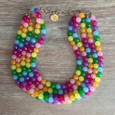 Somewhere Over The Rainbow🌈 These beads are exquisite! This necklace goes with EVERYTHING!  Simply Stunning! Necklace is 18" long with a 4.5" gold chain for easy adjusting Click Here for the Matching Earrings! https://www.etsy.com/listing/913142571/crystal-earring-crystal-stud-earring?ref=shop_home_active_2&sca=1&sts=1 Click Here for the Matching Bracelet! https://www.etsy.com/listing/1139788336/sparkling-bracelet-stretch-crystal?ref=shop_home_active_1&pro=1&sts=1 All our necklaces arrive in an Cheap Rainbow Necklace With Large Beads, Adjustable Jewelry For Pride Festival Gift, Rainbow Round Bead Adjustable Necklace, Adjustable Rainbow Round Bead Necklaces, Rainbow Multi-strand Necklace Gift, Rainbow Multi-strand Necklace As Gift, Rainbow Multi-strand Jewelry For Gifts, Rainbow Multi-strand Necklace For Gift, Rainbow Round Beads Jewelry Gift