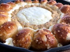 a pan filled with rolls and cream cheese