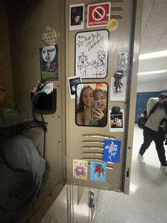 a door with pictures and stickers on it