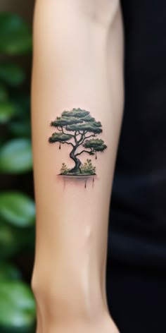 An elegant, minimalistic bonsai tattoo enhances the hand, signifying the wearer's deep-rooted appreciation for nature. Visit our 'TreeTee' Etsy shop, where each tee bought supports our tree-planting initiative, turning your fashion statement into an eco-friendly act. Aesthetic Hand Tattoo, Tree Tattoo Art, Bonsai Tree Tattoos, Planting A Tree, Band Tattoo Designs, Petite Tattoos