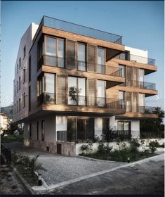 an apartment building with balconies on the top floor and balconies on the second floor