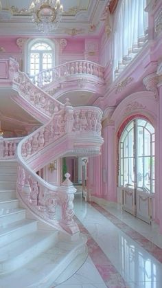 a pink and white staircase with chandelier in an ornately decorated house,