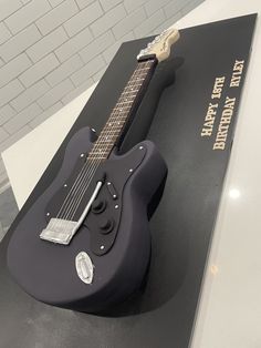 an electric guitar sitting on top of a display case