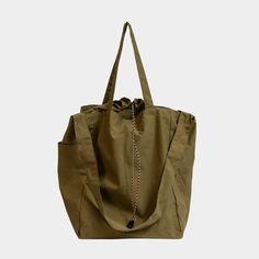 A versatile, water-repellent, 3-way packable tote bag with multiple pockets, perfect for daily use or travel. Multifunctional Khaki Shoulder Bag For Travel, Everyday Utility Khaki Bags, Multifunctional Packable Bag For Everyday Use, Multifunctional Packable Everyday Bag, Khaki Utility Bag With Functional Pockets, Utility Travel Bags With Zippered Pockets, Eco-friendly Khaki Shoulder Bag For Travel, Eco-friendly Shoulder Bag With Pockets For Travel, Versatile Packable Duffle Bag For Everyday Use