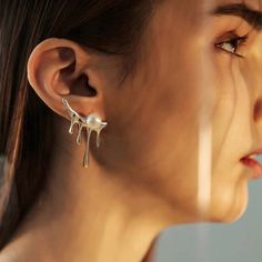 Brighten up your look with our Candle Tears Earrings. Freshly forged in molten metal, these earrings feature unique water-inspired design with dripping ice cream studs. Made with 14K white gold plated vermeil and solid sterling silver posts, these earrings add a touch of whimsy to any outfit. Size: 3cm x 2.5cm Liquid Metal Aesthetic, Underwater Goddess, Slime Oc, Earring Making Ideas, Pearl Texture, Water Shape, Jewellery Styling, Metal Aesthetic, Melting Ice Cream