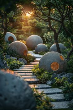 the sun shines through some trees and rocks in a garden with stepping stones on each side