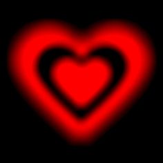 a red heart on a black background with the light reflecting off it's side