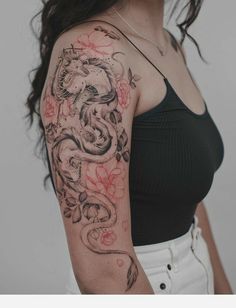 a woman's arm with a dragon tattoo on it and the caption reads, more accurate like this