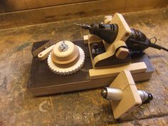 two woodworking tools sitting on top of a wooden table