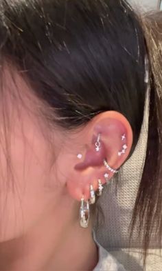 a woman with ear piercings on her ears