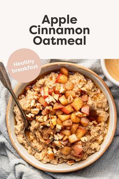 an apple cinnamon oatmeal in a bowl with a spoon on the side