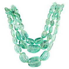 Amazing Triple Strand of Polished Emeralds w/ 14k Gold Clasp Features Graduated Polished Emerald Beads Size of Beads Range from 5 mm wide to 19 mm wide Total Emerald Weight = At Least 400 ct. Includes 14k Yellow Gold Diamond-Studded Clasp w/ Faceted Emerald Size of Clasp = 21 mm x 21 mm Three Strands Range in Length from 25" to 28" Total Mass = 94.9 grams Double Strand Necklace Beaded, Double Strand Pearl Necklace, Black Spinel Necklace, Art Deco Pendant Necklace, Three Strand Necklace, Necklace With Diamond, Necklace Clasp, Black Pearl Necklace, 14k Yellow Gold Necklace