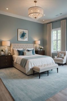 a bedroom with blue walls and white furniture