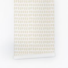 a white and beige wallpaper with circles on it