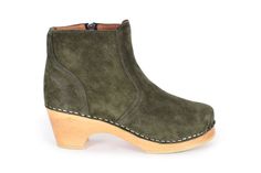 Auckland has a classic boot shape with zipper closure on the inside. Here in Moss Green suede leather with soft leather lining and on our natural low heel. The boots fits medium width foot. Heel height: 7 cm Platform height: 2.5 cm Fit: Medium width Leather Upper: Green suede leather Lining: Soft leather lining Wood: Varnished alderwood Footbed: Natural wood for excellent moist absorption Swedish Clogs, Suede Clogs, Clog Boots, Classic Boots, Green Suede, Moss Green, Auckland, Brown Suede, Boot Shoes Women