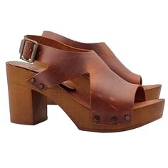 The handcrafted brown heeled sandals are a perfect combination of tradition, high quality and modernity to wear. Versatile and comfortable, they are ideal for all-day wear. Women's clogs with brown wood effect base Upper in brown leather, with two lateral notches Padded insole in leather Adjustable ankle strap 8 cm wide heel + 2.5 cm plateau Stable and light Made entirely by specialized Italian personnel Handcrafted products using the best materials. BEFORE PURCHASING DO NOT FORGET TO CHECK THE High Heel T-strap Sandals With Leather Sole For Summer, Elegant Brown Sandals With 4-inch Heel, Brown Slingback Sandals With Ankle Strap And Leather Sole, Brown Slingback Sandals With Leather Sole, Brown Closed Toe Medium Width Slingback Pumps, Brown Open Toe Slingback Sandals With Leather Sole, Brown T-strap Sandals With Ankle Strap, Brown Open Toe Wedge Sandals, Brown Medium Width Closed Toe Slingback Pumps