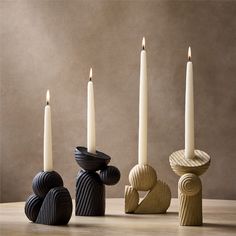 three candles sitting next to each other on top of a table