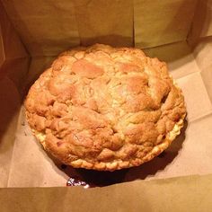 an apple pie sitting in a brown paper bag