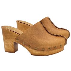 This sabot, with a decidedly folk style, cannot go unnoticed among our clogs! Perfect for lovers of daily comfort, but always with a chic and trendy note! Women's clogs with brown wood effect base Upper in tan leather Rounded closed toe Padded leather insole 8.5 cm wide heel + 3 cm plateau Made entirely by specialized Italian personnel Handcrafted products using the best materials. BEFORE PURCHASING DO NOT FORGET TO CHECK THE SIZE! Brown Mules With Reinforced Heel And Round Toe, Brown Round Toe Mules With Reinforced Heel, Brown Mules With Wooden Heel And Almond Toe, Brown Closed Toe Mules With Reinforced Heel, Brown Mules With Stacked Heel And Round Toe, Brown Mules With Leather Footbed And Block Heel, Brown Almond Toe Mules With Stacked Heel, Brown Leather Footbed Mules With Block Heel, Brown Clogs With Rubber Sole And Block Heel