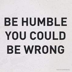 the words be humble you could be wrong written in blue ink on a white background